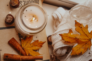 A candle with dried leaves.