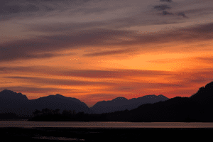 Sunset over hills and loch.
