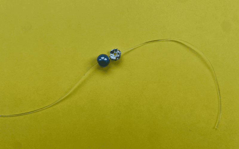 Elastic with two beads on it.