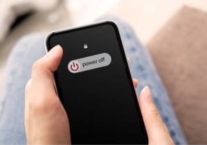 A mobile phone being switched off.